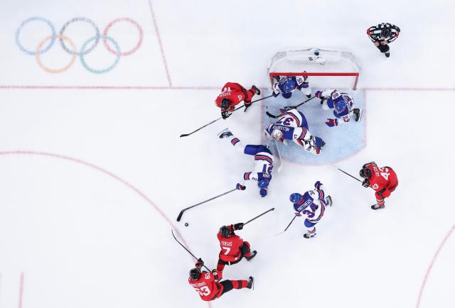 (260222) -- MILAN, Feb. 22, 2026 (Xinhua) -- Goalkeeper Connor Hellebuyck of the United States saves the puck during the ice hockey men's gold medal game between Canada and the United States at the Milan-Cortina 2026 Olympic Winter Games in Milan, Italy, Feb. 22, 2026. (Xinhua/Tao Xiyi)