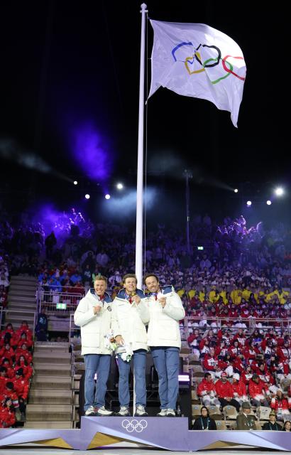 (260222) -- VERONA, Feb. 22, 2026 (Xinhua) -- Gold medalist Johannes Hoesflot Klaebo (C) of Norway, silver medalist Martin Loewstroem Nyenget (L) of Norway, and bronze medalist Emil Iversen of Norway attend the medal ceremony for the cross-country skiing men's 50km mass start classic event during the closing ceremony of the Milan-Cortina 2026 Olympic Winter Games at Verona Olympic Arena in Verona, Italy, Feb. 22, 2026. (Xinhua/Li Ming)