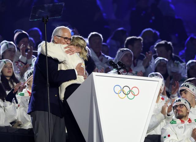 (260222) -- VERONA, Feb. 22, 2026 (Xinhua) -- Giovanni Malago (L), president of the Milan-Cortina 2026 organizing committee, hugs International Olympic Committee (IOC) President Kirsty Coventry during the closing ceremony of the Milan-Cortina 2026 Olympic Winter Games at Verona Olympic Arena in Verona, Italy, Feb. 22, 2026. (Xinhua/Li Ming)
