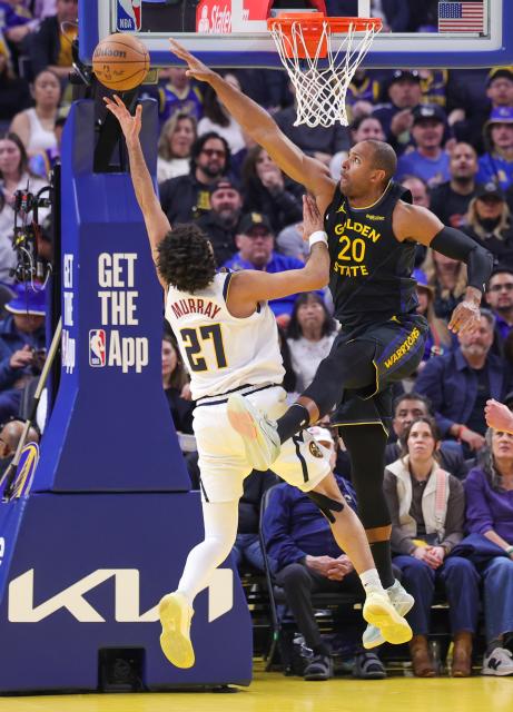 (260223) -- SAN FRANCISCO, Feb. 23, 2026 (Xinhua) -- Jamal Murray (L) of Denver Nuggets vies with Al Horford of Golden State Warriors during the 2025-2026 NBA regular season game between Golden State Warriors and Denver Nuggets in San Francisco, the United States, Feb. 22, 2026. (Photo by Arthur Dong/Xinhua)