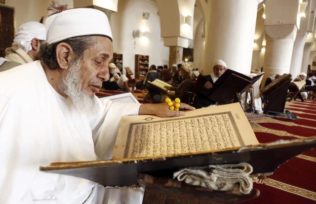(260223) -- SANAA, Feb. 23, 2026 (Xinhua) -- People recite the Quran inside the Great Mosque during Ramadan in Sanaa, Yemen, Feb. 22, 2026. (Photo by Mohammed Mohammed/Xinhua)