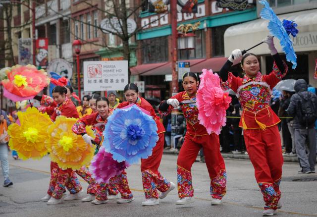 (260223) -- VANCOUVER, Feb. 23, 2026 (Xinhua) -- Dancers perform along the street during a Spring Festival parade at Chinatown in Vancouver, British Columbia, Canada, on Feb. 22, 2026. The 52nd annual Vancouver Chinatown Spring Festival Parade was held here on Sunday to celebrate the Chinese Year of the Horse. (Photo by Liang Sen/ Xinhua)