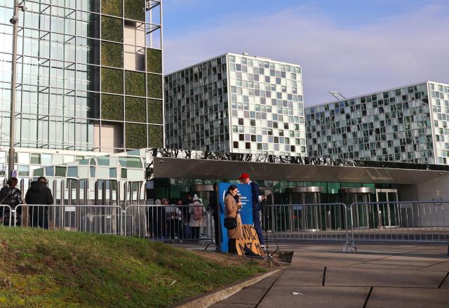 (260223) -- THE HAGUE, Feb. 23, 2026 (Xinhua) -- People queue up to enter the International Criminal Court in The Hague, the Netherlands, on Feb. 23, 2026. The International Criminal Court (ICC) on Monday opened a confirmation of charges hearing for former Philippine president Rodrigo Duterte. (Photo by Sun Jingjing/Xinhua)
