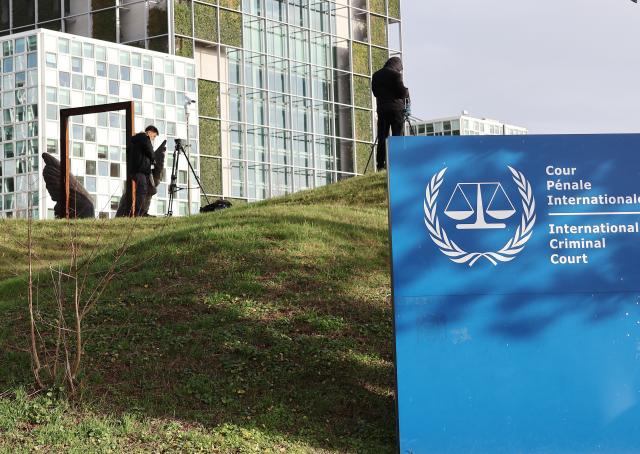 (260223) -- THE HAGUE, Feb. 23, 2026 (Xinhua) -- Cameramen work outside of the International Criminal Court in The Hague, the Netherlands, on Feb. 23, 2026. The International Criminal Court (ICC) on Monday opened a confirmation of charges hearing for former Philippine president Rodrigo Duterte. (Photo by Sun Jingjing/Xinhua)