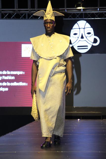 (260223) -- COTONOU, Feb. 23, 2026 (Xinhua) -- A model presents an outfit at the Fashion Week of the 4th Benin International Arts Festival in Cotonou, Benin, on Feb. 22, 2026. (Photo by Seraphin Zounyekpe/Xinhua)