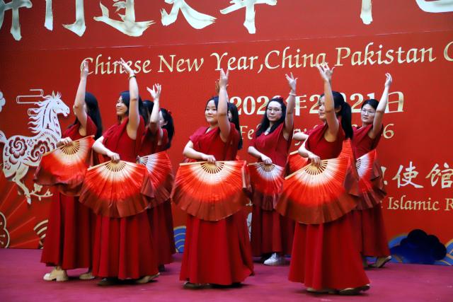 (260223) -- ISLAMABAD, Feb. 23, 2026 (Xinhua) -- People perform during a Spring Festival celebration in Islamabad, capital of Pakistan, on Feb. 21, 2026. The Spring Festival celebration event themed "Chinese New Year, China Pakistan Go Together," hosted by the Chinese Embassy in Pakistan, was held here on Saturday evening.
   Representatives from different sectors of Pakistani society, overseas Chinese, Chinese enterprises, and media attended the event.
   TO GO WITH "Spring Festival celebration event held in Pakistan" (Xinhua/Zhang Jingyao)