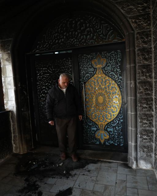 (260223) -- NABLUS, Feb. 23, 2026 (Xinhua) -- A Palestinian inspects the damage at a mosque in the village of Tal, west of Nablus in the West Bank, after Israeli settlers set it on fire at dawn, Feb. 23, 2026. (Photo by Ayman Nobani/Xinhua)