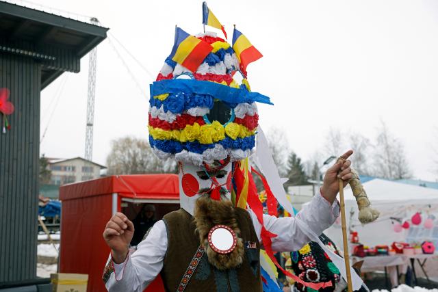 (260223) -- BRANESTI, Feb. 23, 2026 (Xinhua) -- A masked person participates in the annual "Cuckoo's Day" (Ziua Cucilor) festival in Branesti, near Bucharest, capital of Romania, on Feb. 23, 2026. Groups of masked people took part in the traditional festival, singing and dancing for good health and fertility at the beginning of spring. (Photo by Cristian Cristel/Xinhua)