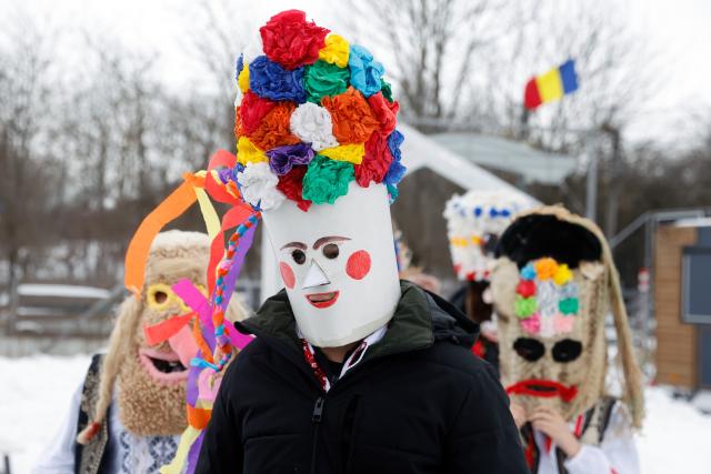 (260223) -- BRANESTI, Feb. 23, 2026 (Xinhua) -- Masked people participate in the annual "Cuckoo's Day" (Ziua Cucilor) festival in Branesti, near Bucharest, capital of Romania, on Feb. 23, 2026. Groups of masked people took part in the traditional festival, singing and dancing for good health and fertility at the beginning of spring. (Photo by Cristian Cristel/Xinhua)
