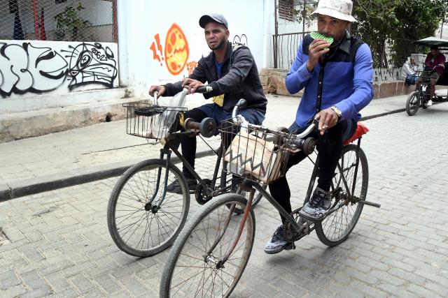 (260223) -- HAVANA, Feb. 23, 2026 (Xinhua) -- People ride their bicycles along a street in Havana, capital of Cuba, Feb. 23, 2026. (Photo by Joaquin Hernandez/Xinhua)