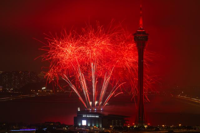 (260224) -- MACAO, Feb. 24, 2026 (Xinhua) -- This photo taken on Feb. 23, 2026 shows a fireworks show above the sea near Macao Tower in Macao, south China. A drone and fireworks show was held on Monday by the Macao Government Tourism Office to celebrate the Spring Festival. (Xinhua/Cheong Kam Ka)