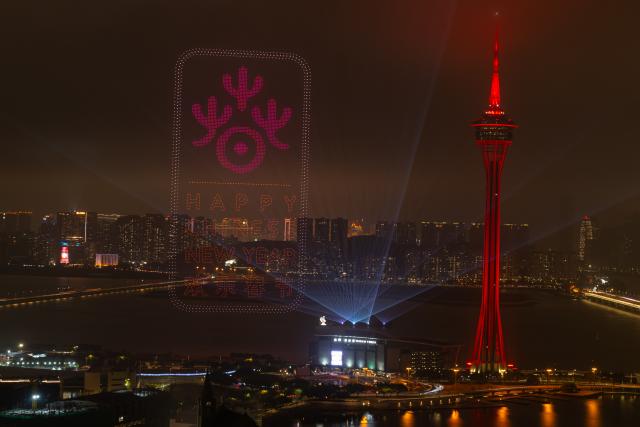 (260224) -- MACAO, Feb. 24, 2026 (Xinhua) -- This photo taken on Feb. 23, 2026 shows a drone show above the sea near Macao Tower in Macao, south China. A drone and fireworks show was held on Monday by the Macao Government Tourism Office to celebrate the Spring Festival. (Xinhua/Cheong Kam Ka)