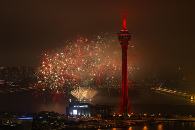 (260224) -- MACAO, Feb. 24, 2026 (Xinhua) -- This photo taken on Feb. 23, 2026 shows a fireworks show above the sea near Macao Tower in Macao, south China. A drone and fireworks show was held on Monday by the Macao Government Tourism Office to celebrate the Spring Festival. (Xinhua/Cheong Kam Ka)