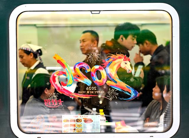 (260224) -- BEIJING, Feb. 24, 2026 (Xinhua) -- Passengers arrive at Nanjing Railway Station in Nanjing, east China's Jiangsu Province, Feb. 22, 2026. China's railways handled 121 million passenger trips during the just-concluded Spring Festival holiday, up 11.5 percent compared with last year's holiday period, official data showed on Tuesday. (Photo by Yang Suping/Xinhua)