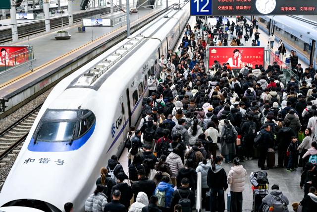 (260224) -- BEIJING, Feb. 24, 2026 (Xinhua) -- Passengers arrive at Nanjing Railway Station in Nanjing, east China's Jiangsu Province, Feb. 23, 2026. China's railways handled 121 million passenger trips during the just-concluded Spring Festival holiday, up 11.5 percent compared with last year's holiday period, official data showed on Tuesday. (Photo by Yang Suping/Xinhua)