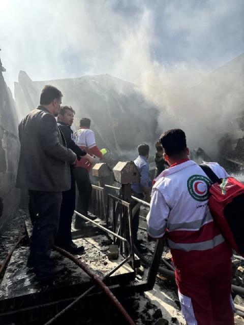 (260224) -- TEHRAN, Feb. 24, 2026 (Xinhua) -- Rescuers work at the site of a helicopter crash in the central province of Isfahan, Iran, Feb. 24, 2026. Four people were killed when an Iranian army helicopter crashed Tuesday morning into a fruit and vegetable market in the central province of Isfahan, the semi-official Fars news agency reported. (Xinhua)