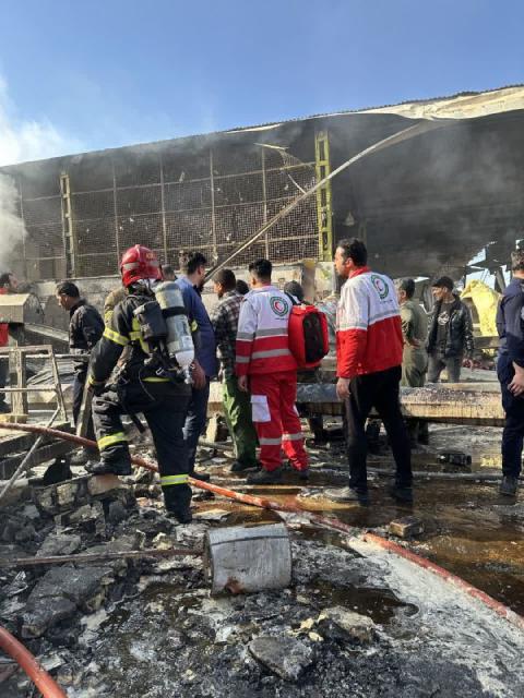 (260224) -- TEHRAN, Feb. 24, 2026 (Xinhua) -- Rescuers work at the site of a helicopter crash in the central province of Isfahan, Iran, Feb. 24, 2026. Four people were killed when an Iranian army helicopter crashed Tuesday morning into a fruit and vegetable market in the central province of Isfahan, the semi-official Fars news agency reported. (Xinhua)