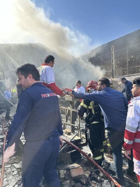 (260224) -- TEHRAN, Feb. 24, 2026 (Xinhua) -- Rescuers work at the site of a helicopter crash in the central province of Isfahan, Iran, Feb. 24, 2026. Four people were killed when an Iranian army helicopter crashed Tuesday morning into a fruit and vegetable market in the central province of Isfahan, the semi-official Fars news agency reported. (Xinhua)