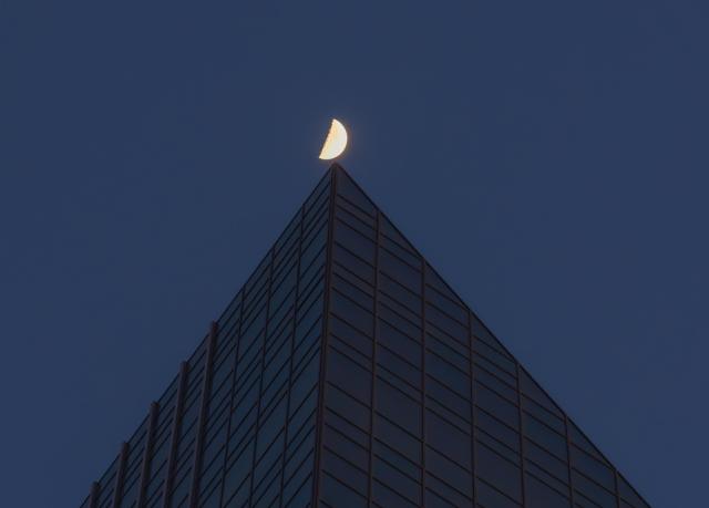 (260224) -- BEIJING, Feb. 24, 2026 (Xinhua) -- A drone photo taken on Feb. 24, 2026 shows the moon over Harbin City, northeast China's Heilongjiang Province. The largest first quarter moon of the year appeared in the sky on Tuesday. The moon was near its perigee in orbit, approximately 370,000 kilometers from the Earth. (Photo by Liu Dapeng/Xinhua)