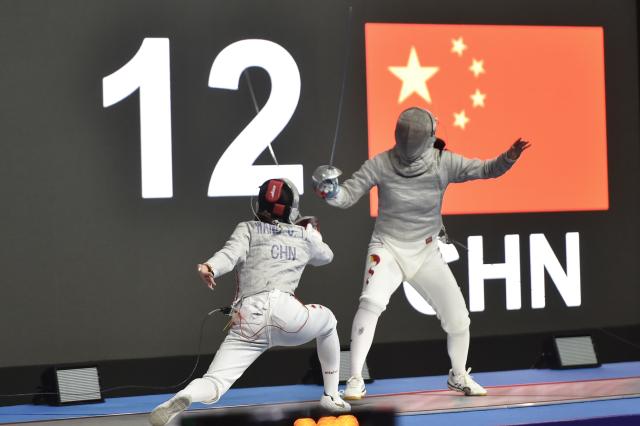 (260224) -- JAKARTA, Feb. 24, 2026 (Xinhua) -- Pan Qimiao (R) of China competes with Wang Chenyi of China during their junior women's sabre final match at the Asian Cadet and Junior Fencing Championship 2026 in Jakarta, Feb. 24, 2026. (Xinhua/Veri Sanovri)