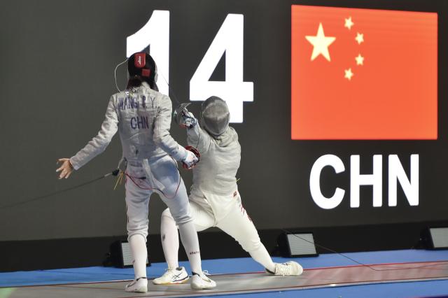 (260224) -- JAKARTA, Feb. 24, 2026 (Xinhua) -- Pan Qimiao (R) of China competes with Wang Chenyi of China during their junior women's sabre final match at the Asian Cadet and Junior Fencing Championship 2026 in Jakarta, Feb. 24, 2026. (Xinhua/Veri Sanovri)