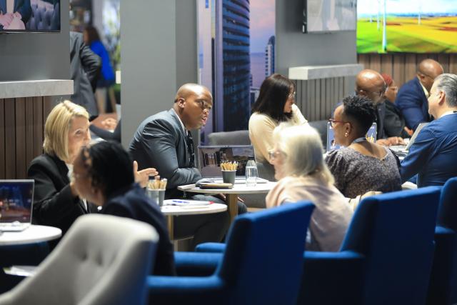 (260224) -- JOHANNESBURG, Feb. 24, 2026 (Xinhua) -- People communicate at the Meetings Africa 2026 in Johannesburg, South Africa, Feb. 24, 2026. The Meetings Africa 2026 opened at the Sandton Convention Centre in Johannesburg on Tuesday. (Xinhua/Chen Wei)
