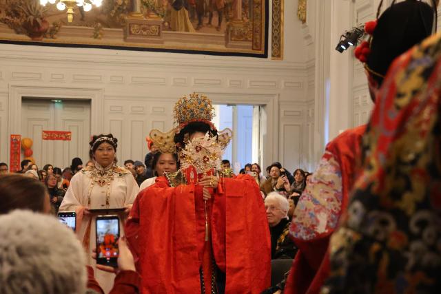 (260224) -- PARIS, Feb. 24, 2026 (Xinhua) -- A Hanfu-themed gala is held at the 13th arrondissement in Paris, France on Feb. 14, 2026. TO GO WITH "Roundup: Future-oriented Chinese New Year in France blends tradition, technology" (Xinhua/Zhang Baihui)