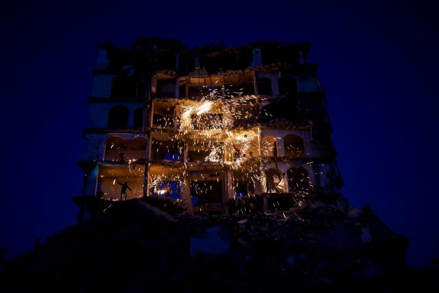 (260224) -- GAZA, Feb. 24, 2026 (Xinhua) -- People set off fireworks in a destroyed building during the holy month of Ramadan, in Jabalia refugee camp, northern Gaza Strip, on Feb. 23, 2026. (Photo by Rizek Abdeljawad/Xinhua)