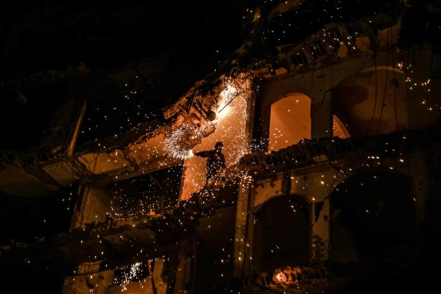 (260224) -- GAZA, Feb. 24, 2026 (Xinhua) -- A man sets off fireworks in a destroyed building during the holy month of Ramadan, in Jabalia refugee camp, northern Gaza Strip, on Feb. 23, 2026. (Photo by Rizek Abdeljawad/Xinhua)