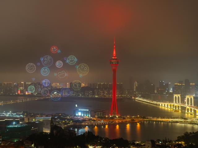 (260225) -- BEIJING, Feb. 25, 2026 (Xinhua) -- This photo taken on Feb. 23, 2026 shows a drone show above the sea near Macao Tower in Macao, south China. A drone and fireworks show was held on Monday by the Macao Government Tourism Office to celebrate the Spring Festival. (Xinhua/Cheong Kam Ka)