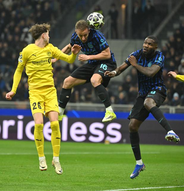 (260225) -- MILAN, Feb. 25, 2026 (Xinhua) -- Inter Milan's Davide Frattesi (C) and Marcus Thuram (R) vie with Bodo/Glimt's Hakon Evjen during the UEFA Champions League play-off second-leg football match between Inter Milan and Bodo/Glimt in Milan, Italy, Feb. 24, 2026. (Photo by Alberto Lingria/Xinhua)