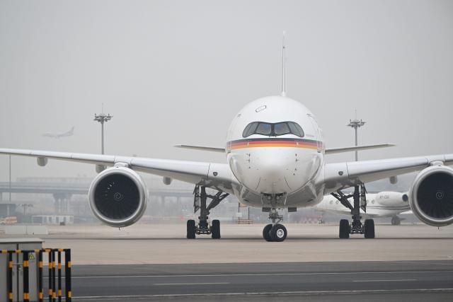 (260225) -- BEIJING, Feb. 25, 2026 (Xinhua) -- The plane carrying German Chancellor Friedrich Merz arrives in Beijing, capital of China, Feb. 25, 2026. Merz arrived here on Wednesday for an official visit to China through Thursday. (Xinhua/Dai Tianfang)