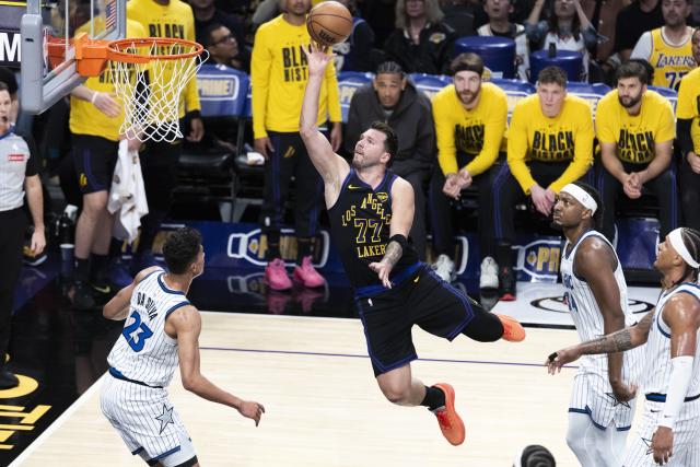 (260225) -- LOS ANGELES, Feb. 25, 2026 (Xinhua) -- Los Angeles Lakers' Luka Doncic (top) shoots during the 2025-2026 NBA regular season basketball game between Los Angeles Lakers and Orlando Magic in Los Angeles, the United States, Feb. 24, 2026. (Photo by Ringo Chiu/Xinhua)