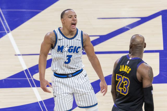 (260225) -- LOS ANGELES, Feb. 25, 2026 (Xinhua) -- Orlando Magic's Desmond Bane (L) celebrates in front of Los Angeles Lakers' LeBron James during the 2025-2026 NBA regular season basketball game between Los Angeles Lakers and Orlando Magic in Los Angeles, the United States, Feb. 24, 2026. (Photo by Ringo Chiu/Xinhua)
