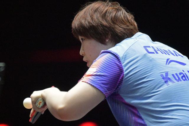 (260227) -- SINGAPORE, Feb. 27, 2026 (Xinhua) -- Kuai Man hits a return during the women's singles round of 16 match between Kuai Man of China and Hayata Hina of Japan at the World Table Tennis (WTT) Singapore Smash 2026 in Singapore on Feb. 27, 2026. (Photo by Then Chih Wey/Xinhua)