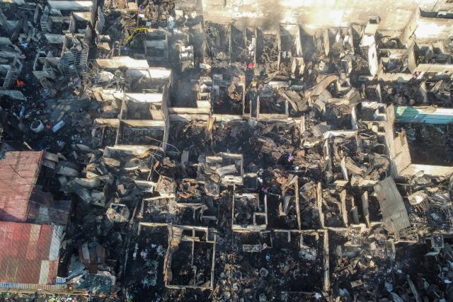 (260227) -- BEIJING, Feb. 27, 2026 (Xinhua) -- This aerial drone photo taken on Feb. 26, 2026 shows a scene after a residential fire at a slum area in Manila, the Philippines. Firefighters on Wednesday placed under control a blaze that tore through a residential area in Manila City, Philippines, forcing the evacuation of hundreds of families and destroying dozens of houses.
  The fire broke out on Wednesday afternoon and quickly spread across closely packed homes, affecting an estimated 600 families in the area, the Manila Disaster Risk Reduction and Management Office said. (Xinhua/Rouelle Umali)