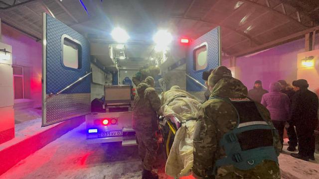 (260227) -- SHCHUCHINSK, Feb. 27, 2026 (Xinhua) -- Rescuers carry a person injured in a gas explosion at a cafe in Shchuchinsk, Akmola, Kazakhstan, on Feb. 27, 2026. Seven people were killed and 19 others injured in a powerful gas explosion that ripped through a cafe in the resort town of Shchuchinsk in northern Kazakhstan, local media reported Friday. (Kazakhstan's Ministry of Emergency Situations/Handout via Xinhua)