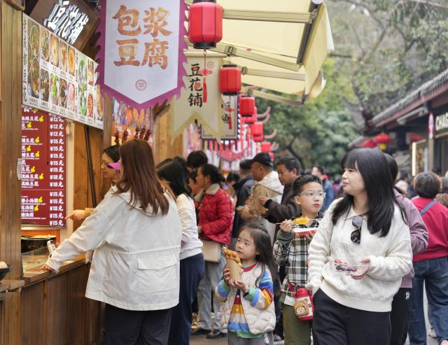 (260227) -- CHENGDU, Feb. 27, 2026 (Xinhua) -- People stroll along a snack street at a temple fair at Wuhou Shrine in Chengdu, southwest China's Sichuan Province, Feb. 27, 2026. The temple fair is held here to mark the ongoing Spring Festival, or the Chinese New Year, which will end on the 15th day of the first lunar month. (Xinhua/Liu Kun)