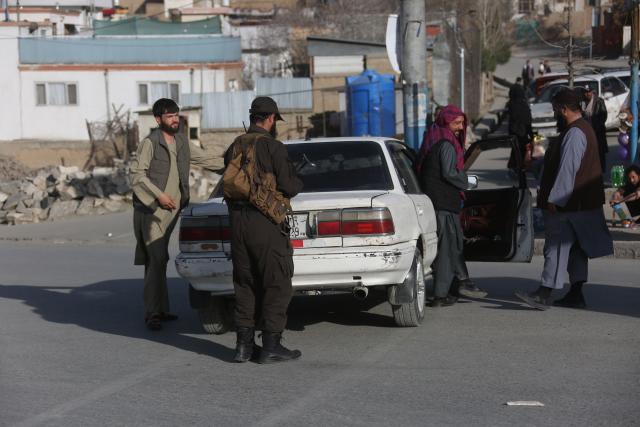 (260227) -- KABUL, Feb. 27, 2026 (Xinhua) -- Security personnel inspect vehicles at a temporary checkpoint following airstrikes in Kabul, Afghanistan, Feb. 27, 2026. Zabihullah Mujahid, spokesperson for the Afghan government, posted on his X account early Friday that the Pakistani military conducted airstrikes in parts of Kabul, southern Kandahar, and eastern Paktia province. (Photo by Saifurahman Safi/Xinhua)