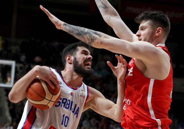 (260228) -- BELGRADE, Feb. 28, 2026 (Xinhua) -- Serbia's Nikola Kalinic (L) vies with Türkiye's Metecan Birsen during the first round group C match between Serbia and Türkiye at the FIBA Basketball World Cup 2027 European Qualifiers in Belgrade, Serbia, on Feb. 27, 2026. (Photo by Predrag Milosavljevic/Xinhua)