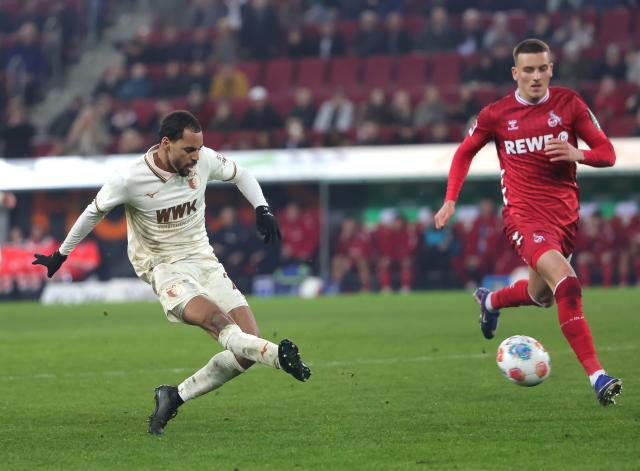 (260228) -- AUGSBURG, Feb. 28, 2026 (Xinhua) -- Alexis Claude Maurice (L) of FC Augsburg shoots to score during the German first division Bundesliga football match between FC Augsburg and FC Cologne in Augsburg, Germany, Feb. 27, 2026. (Photo by Philippe Ruiz/Xinhua)