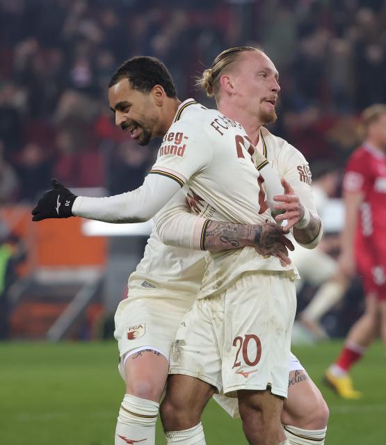 (260228) -- AUGSBURG, Feb. 28, 2026 (Xinhua) -- Alexis Claude Maurice (front) of FC Augsburg celebrates scoring during the German first division Bundesliga football match between FC Augsburg and FC Cologne in Augsburg, Germany, Feb. 27, 2026. (Photo by Philippe Ruiz/Xinhua)