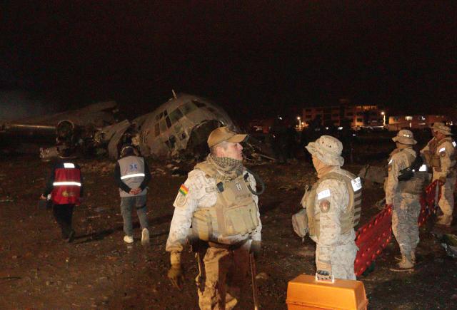(260228) -- EL ALTO, Feb. 28, 2026 (Xinhua) -- The security forces personnel work at a military plane crash site at El Alto International Airport in El Alto, Bolivia, Feb. 27, 2026. At least 15 people were killed and 30 others injured after a Bolivian military plane crashed on Friday in the western city of El Alto, local media reported.
   The South American country's national airline Boliviana de Aviacion announced the temporary closure of El Alto International Airport following the crash.
   No official statement on the crash has been released yet. (Photo by Javier Mamani/Xinhua)
