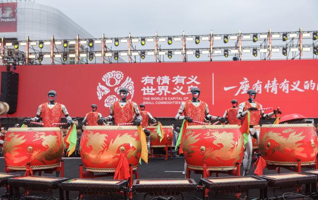 (260228) -- YIWU, Feb. 28, 2026 (Xinhua) -- Humanoid robots stage a performance at the Global Digital Trade Center in Yiwu, east China's Zhejiang Province, Feb. 28, 2026. Merchants on Saturday kicked off the first business day of the Year of the Horse as the Yiwu International Trade City and the Global Digital Trade Center in Yiwu, the world's largest small-commodities hub, resumed operations after the Spring Festival holiday. According to local customs data, Yiwu's total foreign trade reached 836.5 billion yuan (about 121.97 billion U.S. dollars) in 2025, achieving an increase of 25.1 percent year on year. Exports rose more than 24 percent, and imports over 32 percent. (Xinhua/Xu Yu)