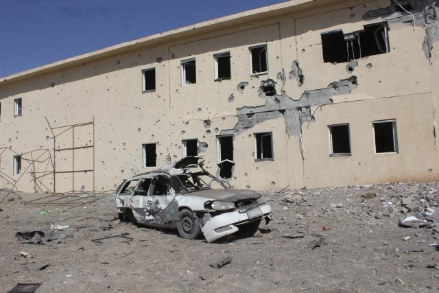 (260228) -- KANDAHAR, Feb. 28, 2026 (Xinhua) -- A damaged building and a shattered car are seen at a temporary camp following a strike in Kandahar province, Afghanistan, Feb. 28, 2026. Three Afghan returnees lost their lives and seven others were injured after Pakistani forces struck a temporary camp of returnees in southern Afghanistan's Kandahar province on Saturday, deputy spokesman of the Afghan government Hamdullah Fitrat said. (Photo by Arghand/Xinhua)