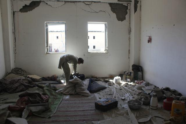 (260228) -- KANDAHAR, Feb. 28, 2026 (Xinhua) -- A man is pictured inside a damaged building after a strike hit a temporary camp in Kandahar province, Afghanistan, Feb. 28, 2026. Three Afghan returnees lost their lives and seven others were injured after Pakistani forces struck a temporary camp of returnees in southern Afghanistan's Kandahar province on Saturday, deputy spokesman of the Afghan government Hamdullah Fitrat said. (Photo by Arghand/Xinhua)