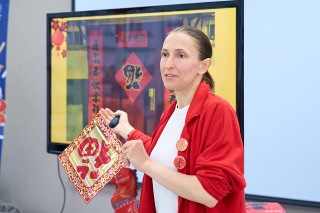 (260228) -- ST. PETERSBURG, Feb. 28, 2026 (Xinhua) -- A sinologist talks about the Chinese custom of posting the Chinese character "Fu," which means good fortune, during an event at a library in St. Petersburg, Russia, Feb. 28, 2026. The event entitled "Traditional Chinese Culture in the Community" was hosted here on Saturday, where a local sinologist talked about culture and customs related to the Chinese Spring Festival. (Photo by Guo Feizhou /Xinhua)