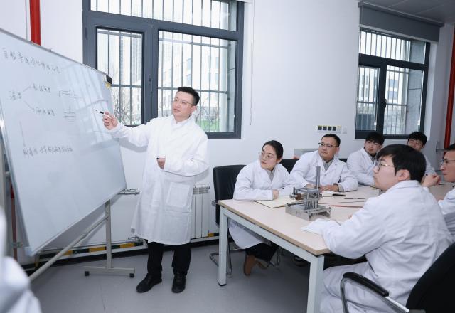 (260228) -- SHANGHAI, Feb. 28, 2026 (Xinhua) -- Zhang Fan presides over a discussion of an experimental plan at a laboratory of an electrical equipment company of China Electrical Equipment Group in Jinan, east China's Shandong Province, Feb. 13, 2026.
  Zhang Fan is vice general manager of China Electrical Equipment Group and a deputy to the National People's Congress (NPC). Zhang believes that "artificial intelligence (AI) plus manufacturing" would be achieved through strengthening top-level design and industry guidelines. Last year, Zhang presented a suggestion on deepening integration of manufacturing and AI to promote high-quality innovative development. His suggestion was given great importance. 
  In January 2026, eight departments of China including the Ministry of Industry and Information Technology jointly issued a plan which outlines an ambitious push to deeply integrate AI with the manufacturing sector, foster new quality productive forces and comprehensively empower new industrialization.
  Zhang stated that he will continue to concentrate on issues about the bottlenecks of data sharing in AI-driven manufacturing sector and successful experiences of leading enterprises. (China Electrical Equipment Group/Handout via Xinhua)