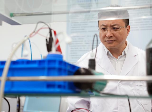 (260228) -- SHANGHAI, Feb. 28, 2026 (Xinhua) -- Zhang Fan inspects a research base of China Electrical Equipment Group in Shanghai, east China, Jan. 27, 2026.
  Zhang Fan is vice general manager of China Electrical Equipment Group and a deputy to the National People's Congress (NPC). Zhang believes that "artificial intelligence (AI) plus manufacturing" would be achieved through strengthening top-level design and industry guidelines. Last year, Zhang presented a suggestion on deepening integration of manufacturing and AI to promote high-quality innovative development. His suggestion was given great importance. 
  In January 2026, eight departments of China including the Ministry of Industry and Information Technology jointly issued a plan which outlines an ambitious push to deeply integrate AI with the manufacturing sector, foster new quality productive forces and comprehensively empower new industrialization.
  Zhang stated that he will continue to concentrate on issues about the bottlenecks of data sharing in AI-driven manufacturing sector and successful experiences of leading enterprises. (Xinhua/Liu Ying)