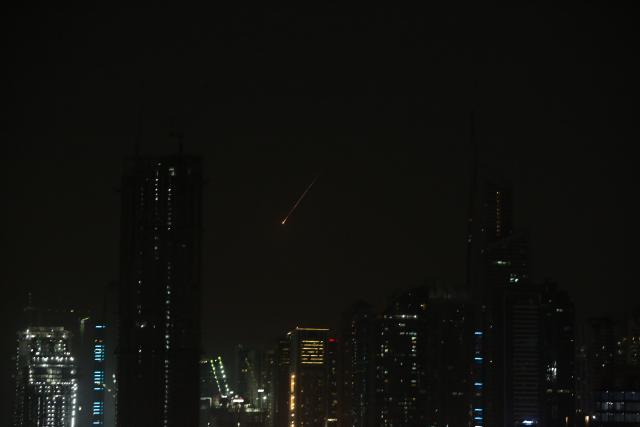 (260228) -- UAE, Feb. 28, 2026 (Xinhua) -- Flares from flying missiles are pictured over Dubai, the United Arab Emirates (UAE), Feb. 28, 2026. UAE said it has intercepted a new wave of Iranian missiles on Saturday. (Xinhua/Wen Xinnian)
